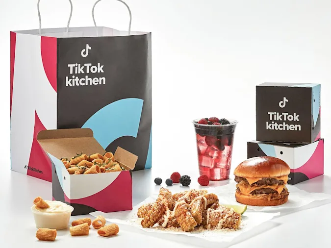 Presentation of TikTok Kitchen with delivery bags and examples of online recipes. Credit TikTok/Virtual Dining Concepts.