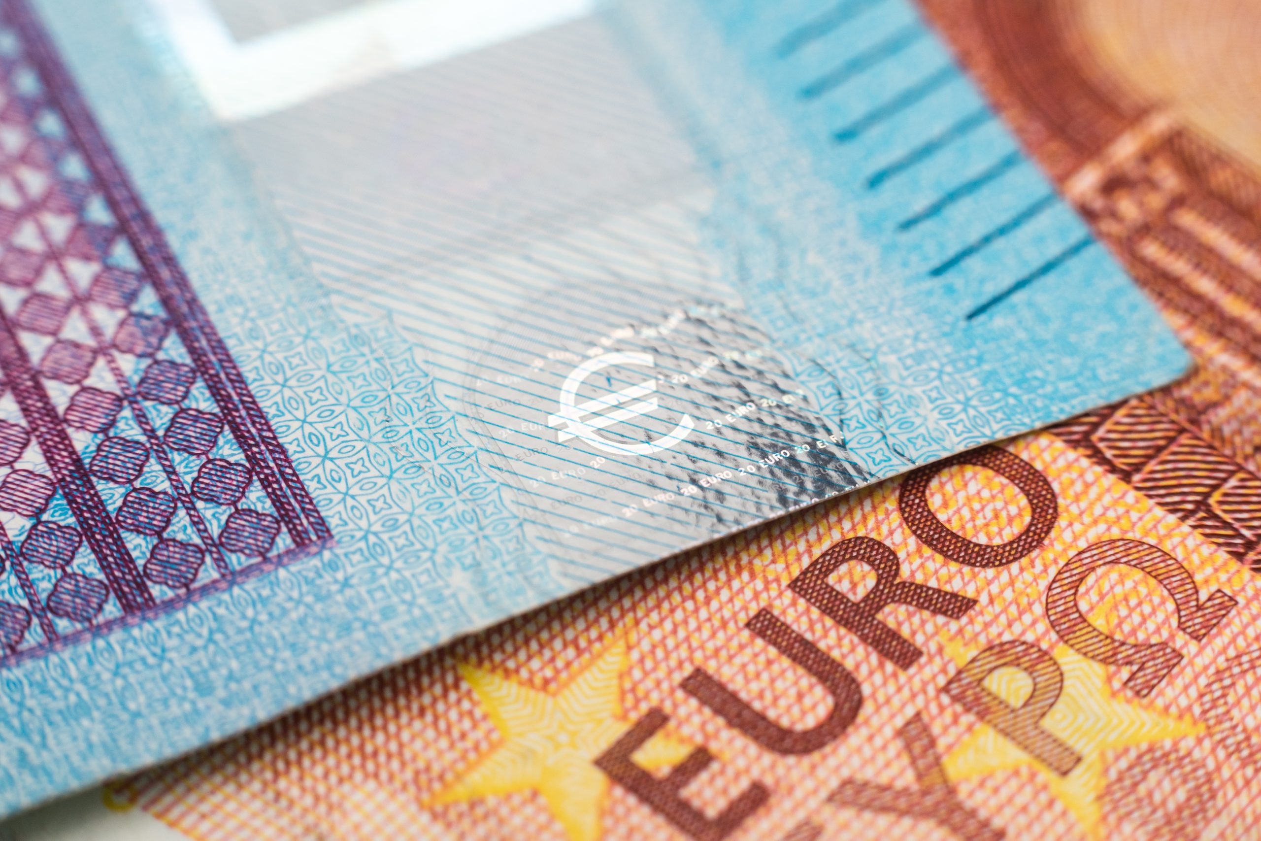 Macro photograph of the word euro on a euro banknote.