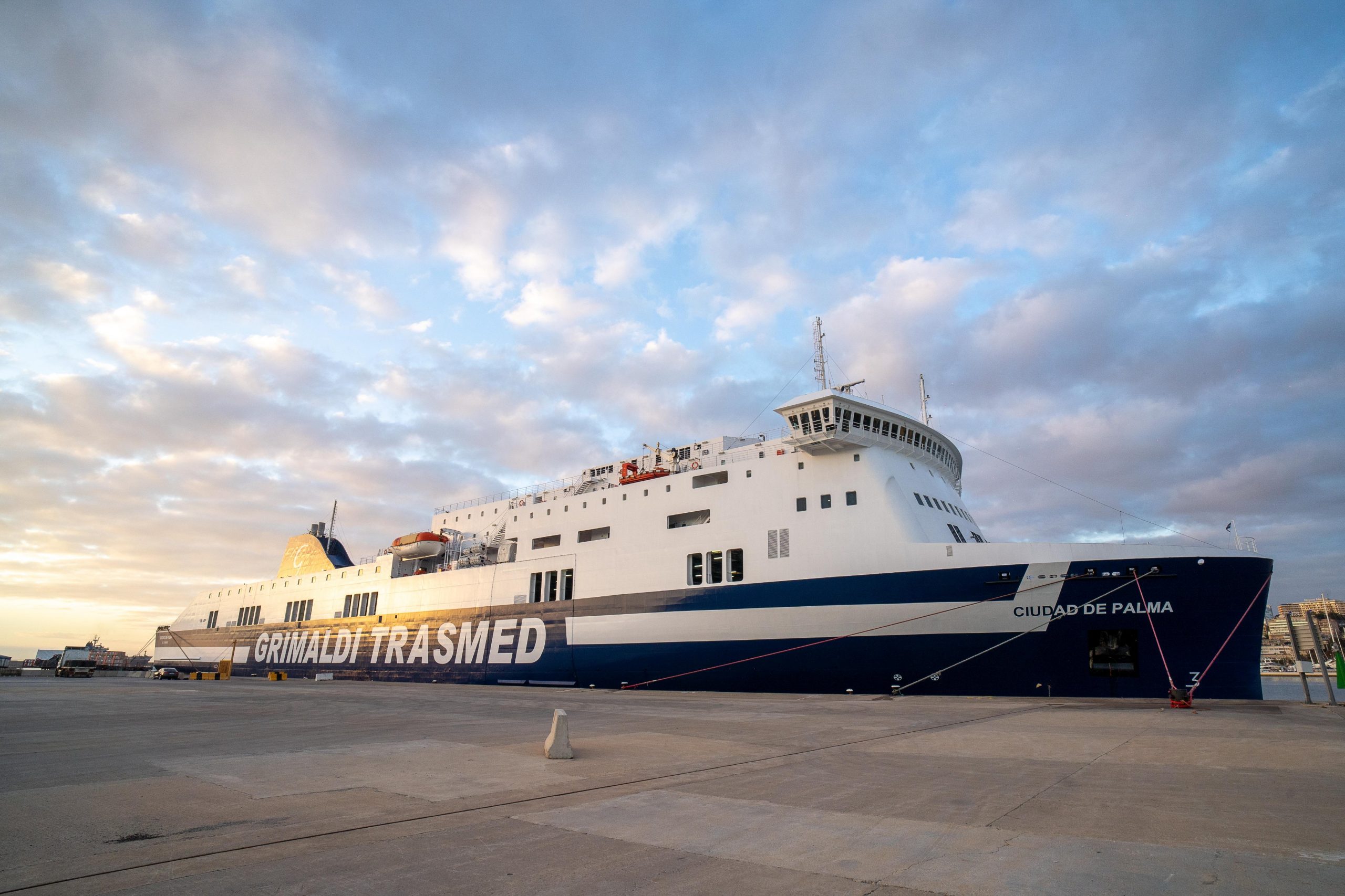 Grimaldi Trasmed's ship sailing in port.